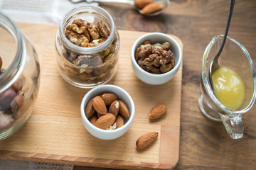 Assorted nuts: walnuts, almonds, hazelnuts and honey