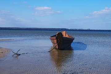 Old wooden fishing boat near the shore