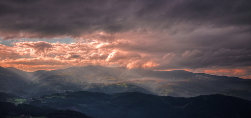 Pink Cloudy sunset over the mountains