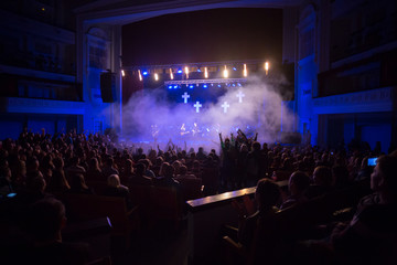 Audience watching the scene with artists.