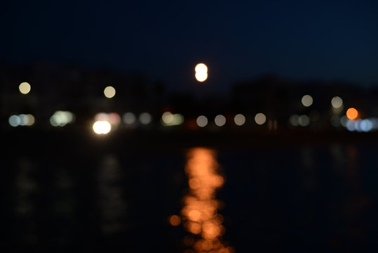 Bokeh city or ship night lights reflection view blur background