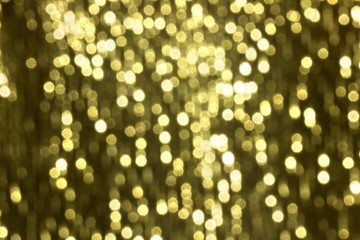 Fototapeta na wymiar Glitter sparkling abstract gold bokeh defocused background