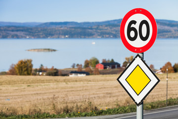 Main road and speed limit road signs