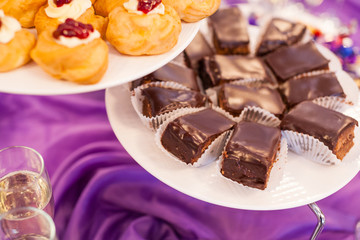 fourchette, custard cakes, Sweet holiday buffet with cupcakes and other desserts, cathering in the restaurant, chocolate cakes
