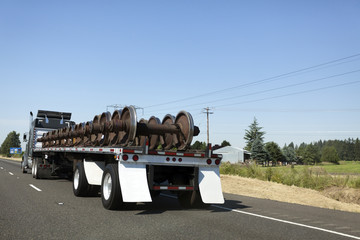 Flatbed Semi Transporting Train Wheels