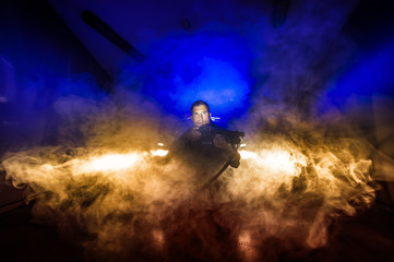 Obraz na płótnie Canvas Police in training between fire and smoke