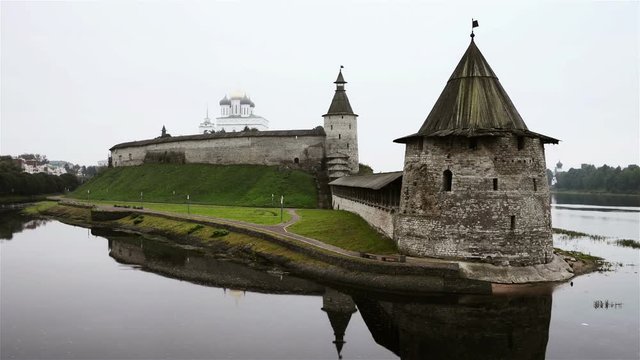 Pskov Kremlin in the cloudy morning. Time-lapse of water. Popular landmark in Russia.