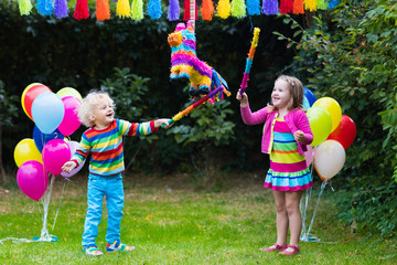Kids playing with birthday pinata