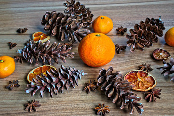 Fruit and pine cones on a wooden table