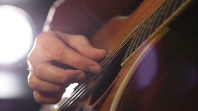 Performing chords on acoustic guitar