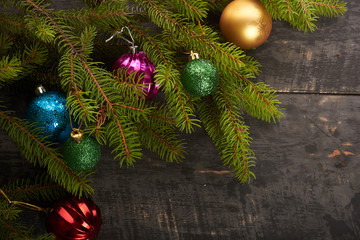 Christmas tree and decorations on wooden background