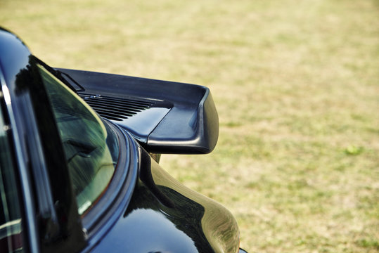 Close Up On  Dark Blue Sports Car Spoiler