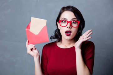 woman in black dress with envelope