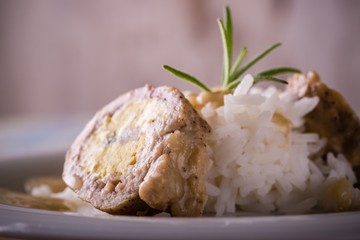 Single portion of meat roll filled by eggs and rice