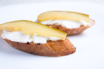 Bruschetta crostini with pear and cheese. Italian food