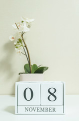 Closeup white wooden calendar with black 1 november word with wh