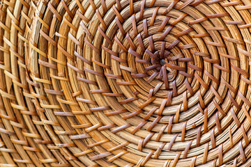 Closeup of beige basket. Wicker woven pattern for abstract background or texture. Circle, selective focus
