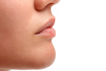 Obraz premium Young beautiful female face close up portrait with lips without