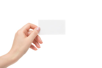 Isolated female hand holds white card on a white background.