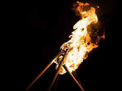 Flaming torches at night