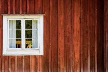 Obraz na płótnie Canvas White window of a wooden house in Sweden