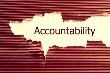Accountability word written under torn paper.