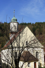 NEUENBUERG, GERMANY - MAI 07, 2016: Residential tudor style church, with blue sky in background near a Castle.