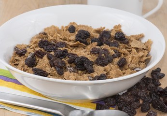 Healthy breakfast cereal with raisins in a bowl