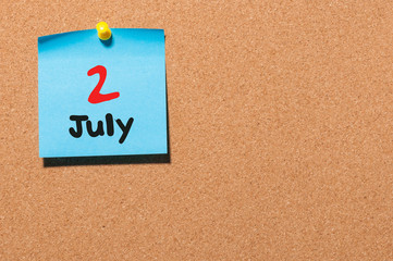 July 2nd. Day 2 of month, color sticker calendar on notice board. Summer time. Empty space for text