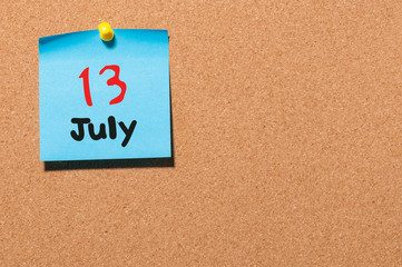 July 13th. Day 13 of month, color sticker calendar on notice board. Summer time. Empty space for text