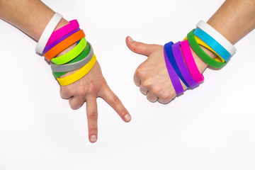 Blank rubber wristbands on wrist arm. Silicone fashion round social bracelet wear  hand. Unity band.