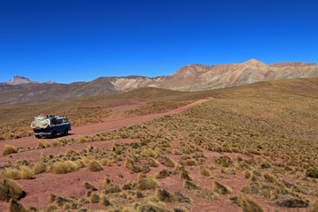 Van cruising an abondend road in the bolivian andes mountains in a very nice valley near Tupiza