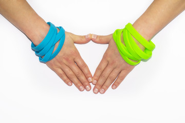 Blank rubber wristbands on wrist arm. Silicone fashion round social bracelet wear  hand. Unity band.