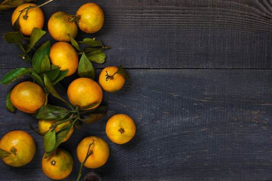 Yellow mandarins on the table