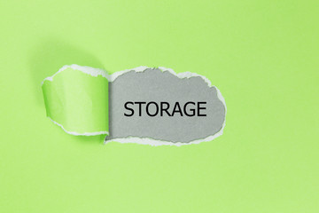 The word Storage appearing behind torn paper. 