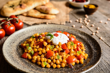 Traditional Indian Channa Masala – spicy chick peas with tomato, pepper and curry