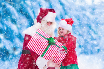 Kids and Santa with Christmas presents