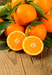 Fresh oranges on a wooden table