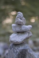 Stone pyramide with river on backbaround peace symbol
