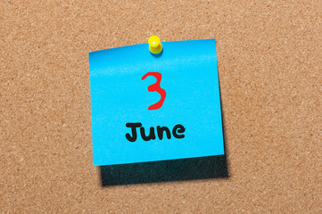 June 3rd. Day 3 of month, color sticker calendar on notice board. Summer time. Close up