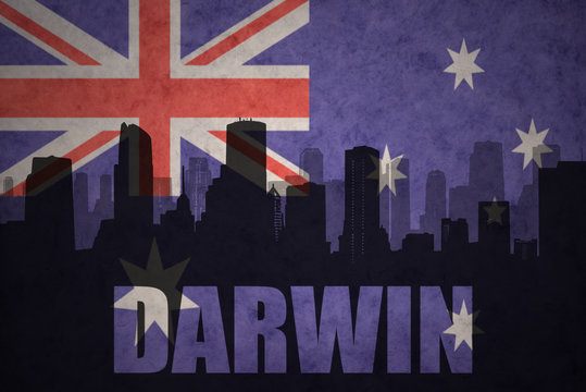abstract silhouette of the city with text Darwin at the vintage australian flag