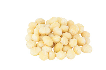 delicious macadamia nuts on  plate on  wooden background