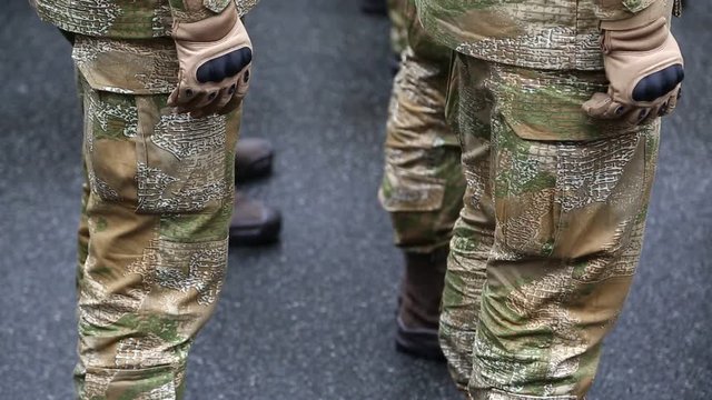 Servicemen at the military parade. Soldiers in military uniform
