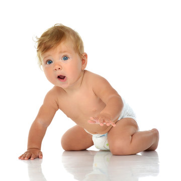 Infant child baby girl in diaper crawling happy yelling screamin