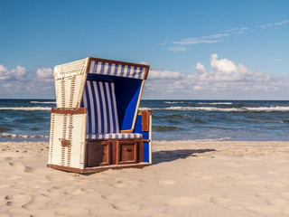 Roofed wicker beach chair