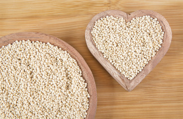 Quinoa seeds in wooden bowl