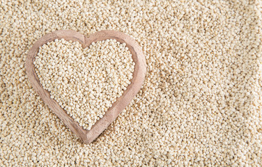 Quinoa seeds in wooden bowl