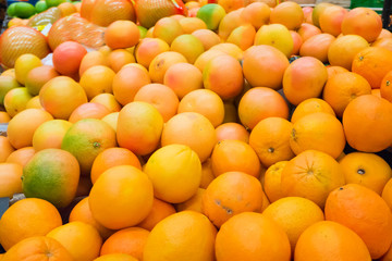 Pile of fresh oranges and mandarins