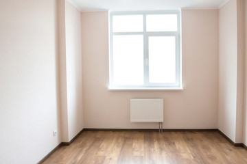 Empty room with window and wooden floor