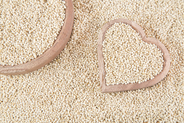 Quinoa seeds in wooden bowl